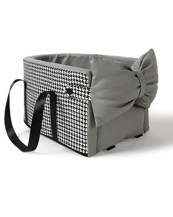 Gray pet carrier with houndstooth patterned front panel, padded interior, black handles, and bow detail on side for pets, suitable for travel.