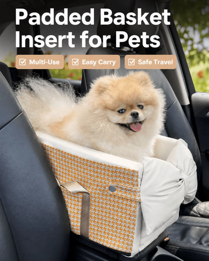 Padded pet basket insert with orange and white houndstooth pattern, secured with gray straps, designed for car travel with a fluffy Pomeranian puppy inside