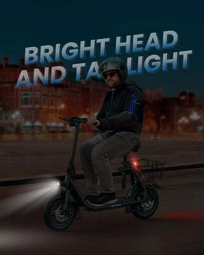 Rider on Gyroor C1 seated electric scooter at night with headlight and tail light
